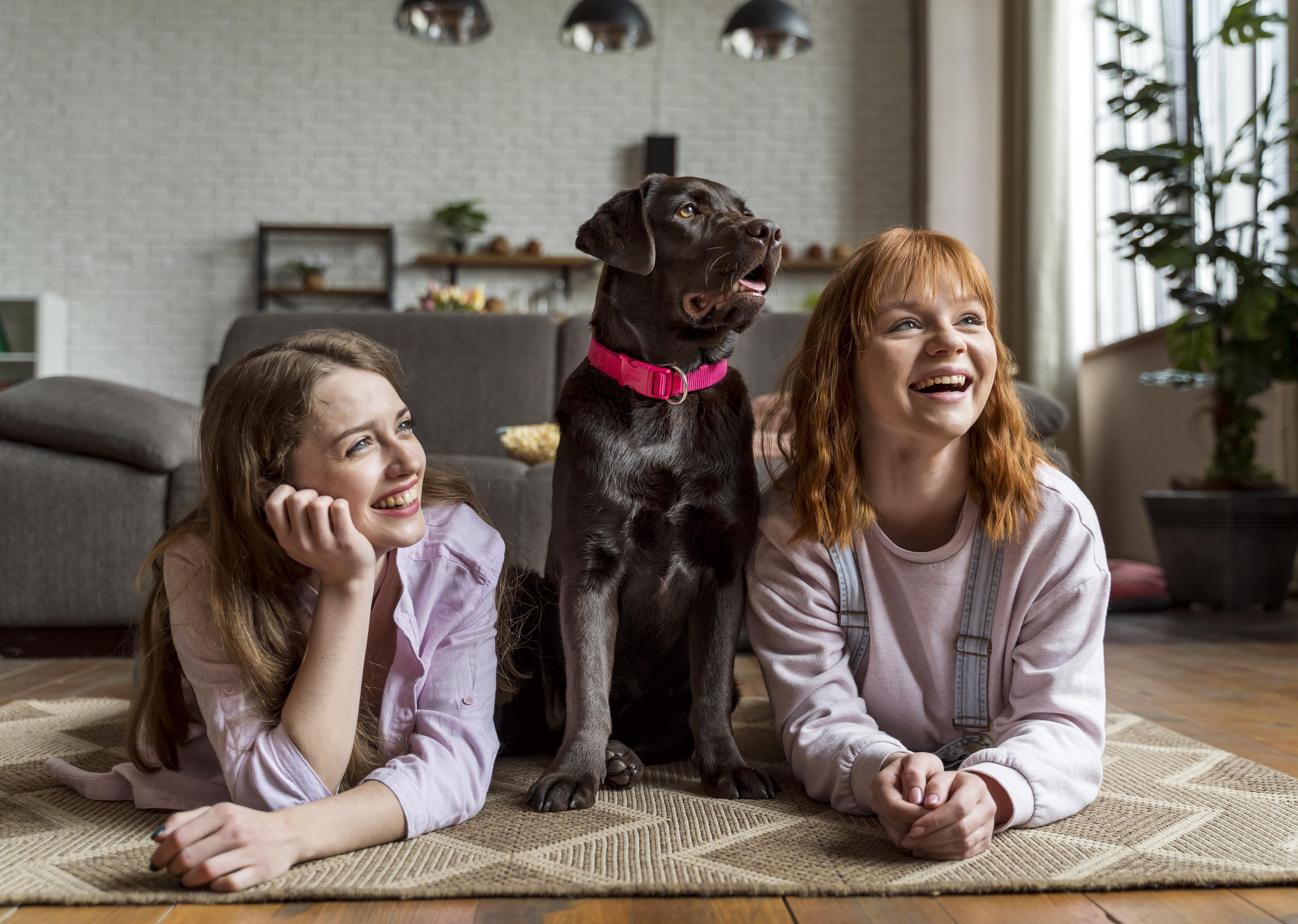 girls with family dog