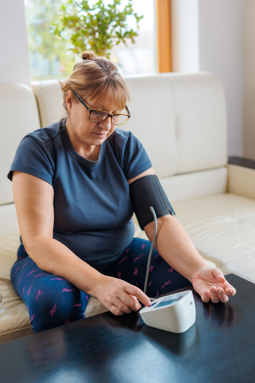 woman checking blood pressure