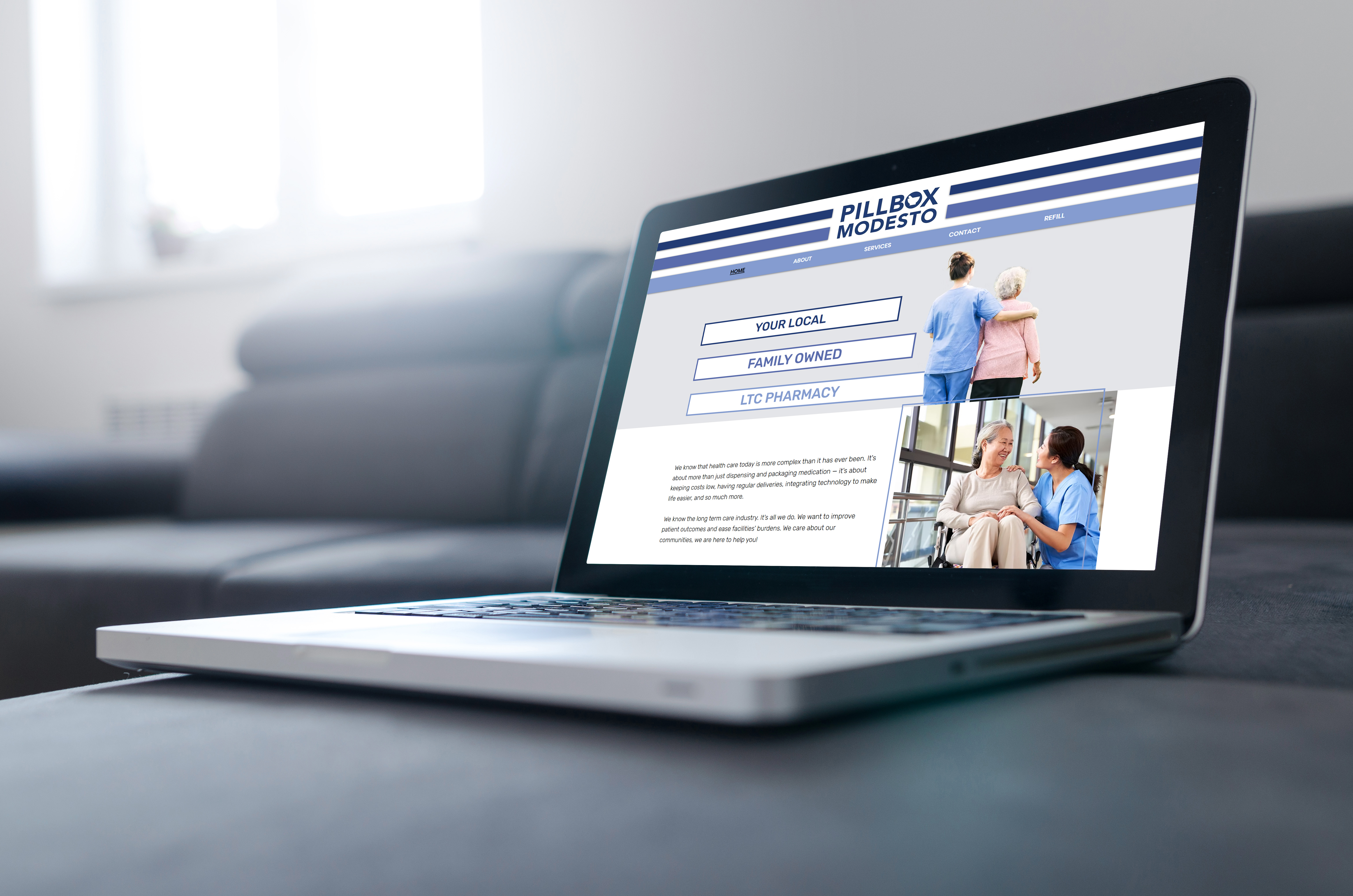 new pharmacy's website displayed on computer sitting on couch