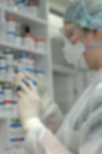 compounding pharmacist filling syringe