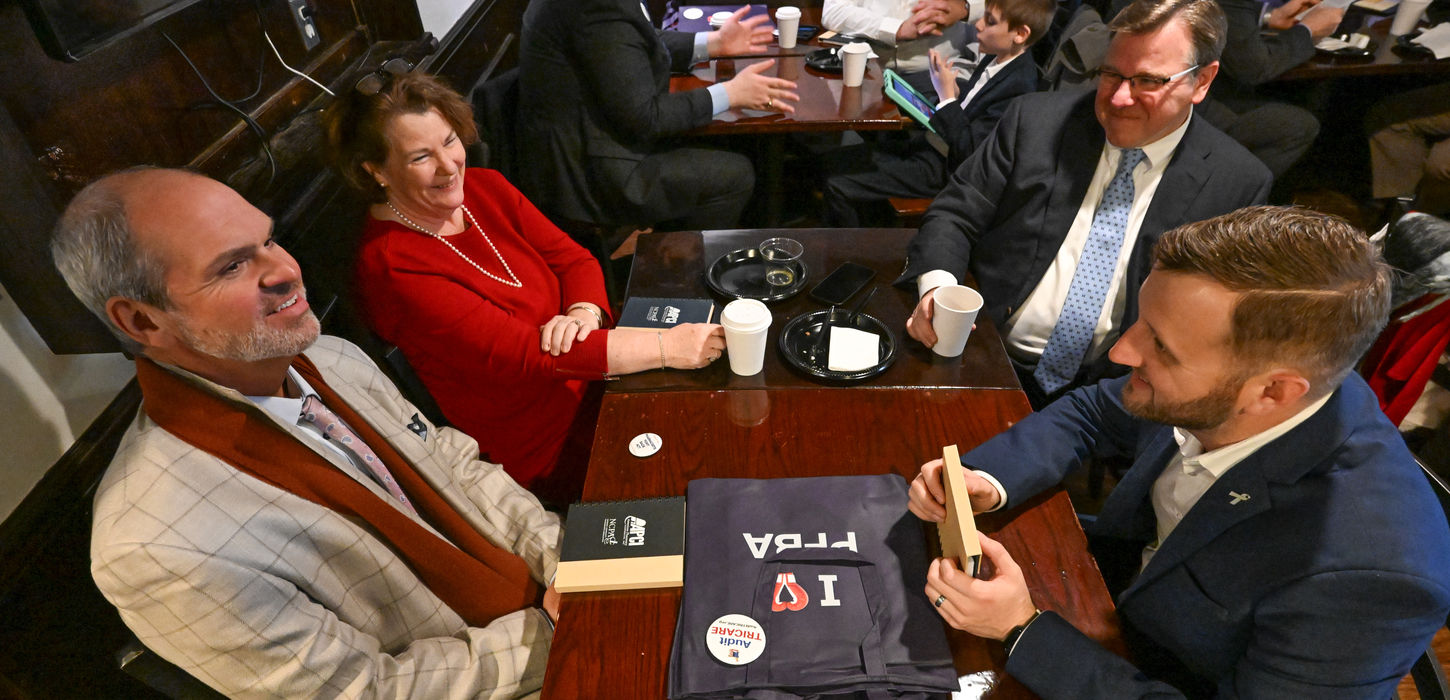 People sitting around a table in Washington DC for PFBA