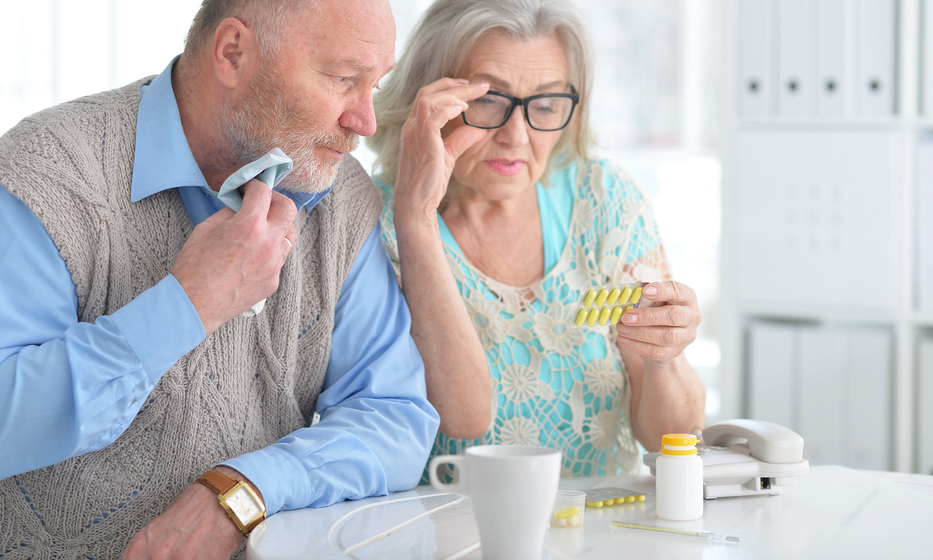 senior couple looking at medication information