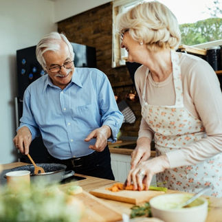 older couple cooking in a kitchen