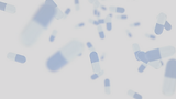 blue pills capsules falling background