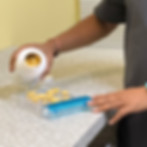 close-up of pharmacist pouring capsules into a counting tray