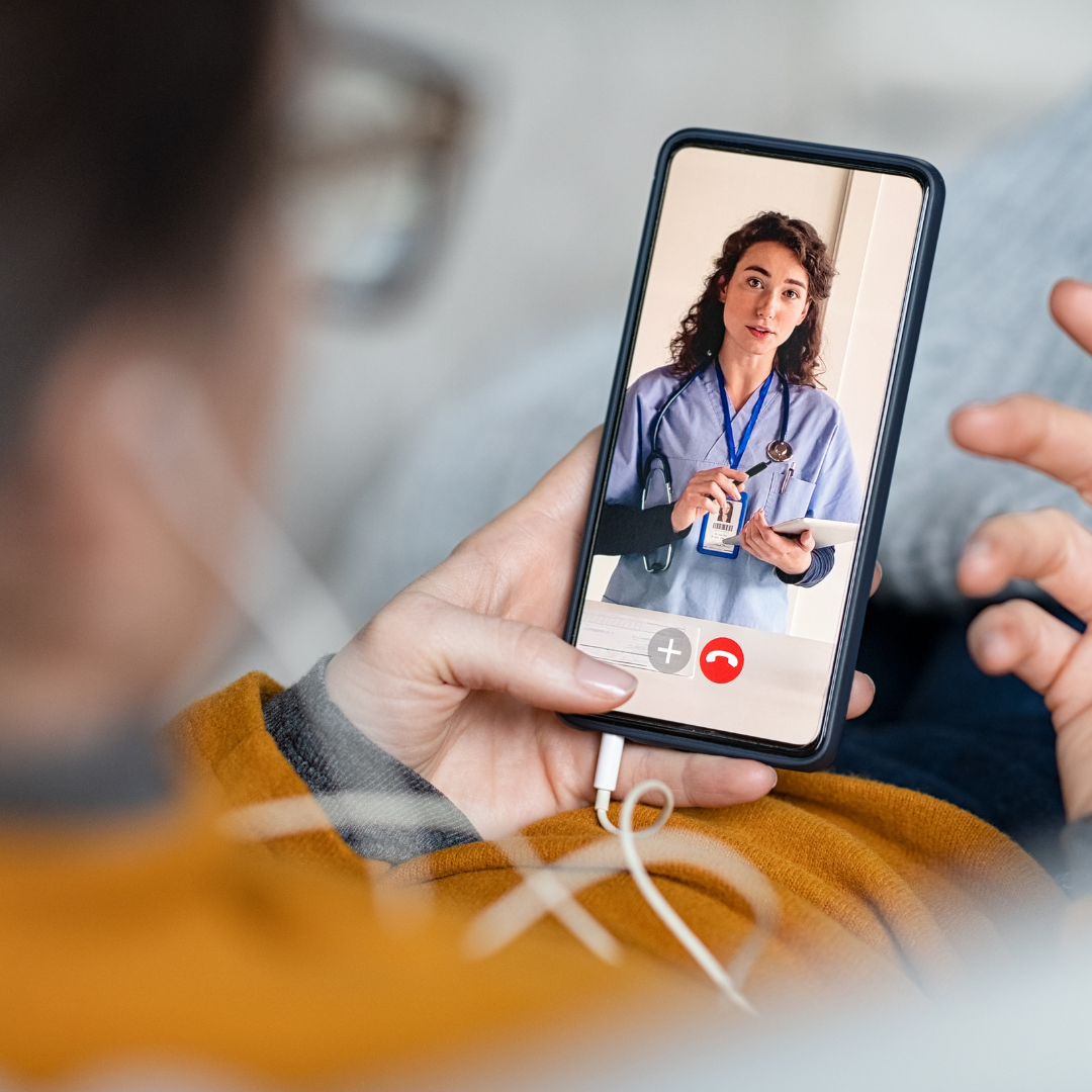 virtual visit on cell phone with female doctor