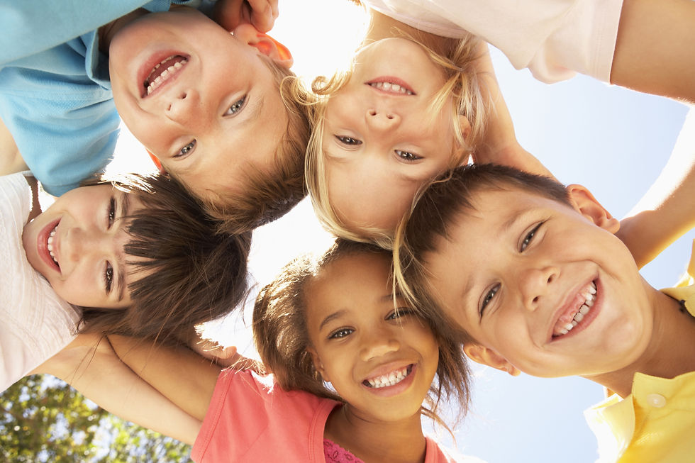 Kids smiling in circle