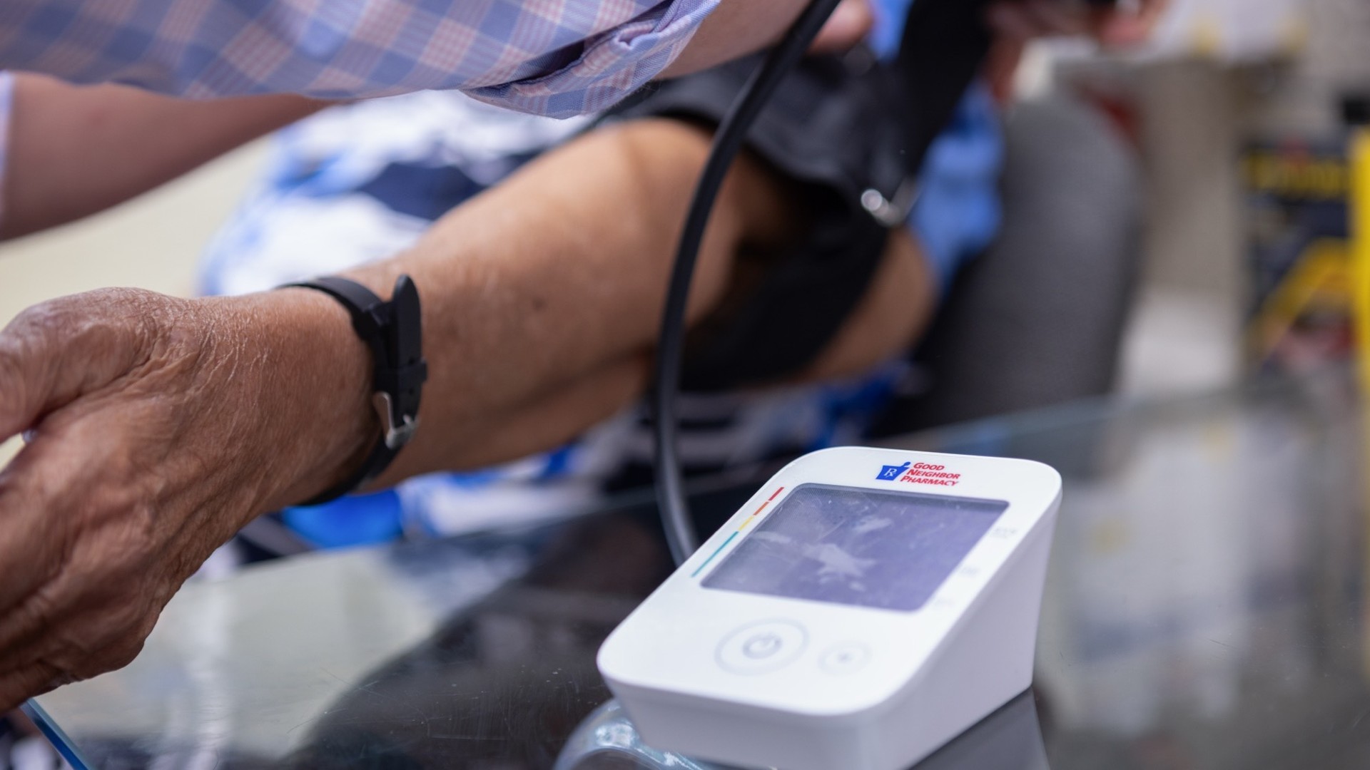 senior getting blood pressure taken