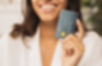 woman holding up payment card