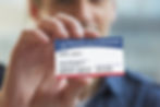 person holding Medicare insurance card
