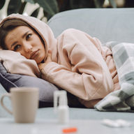 sick woman on couch