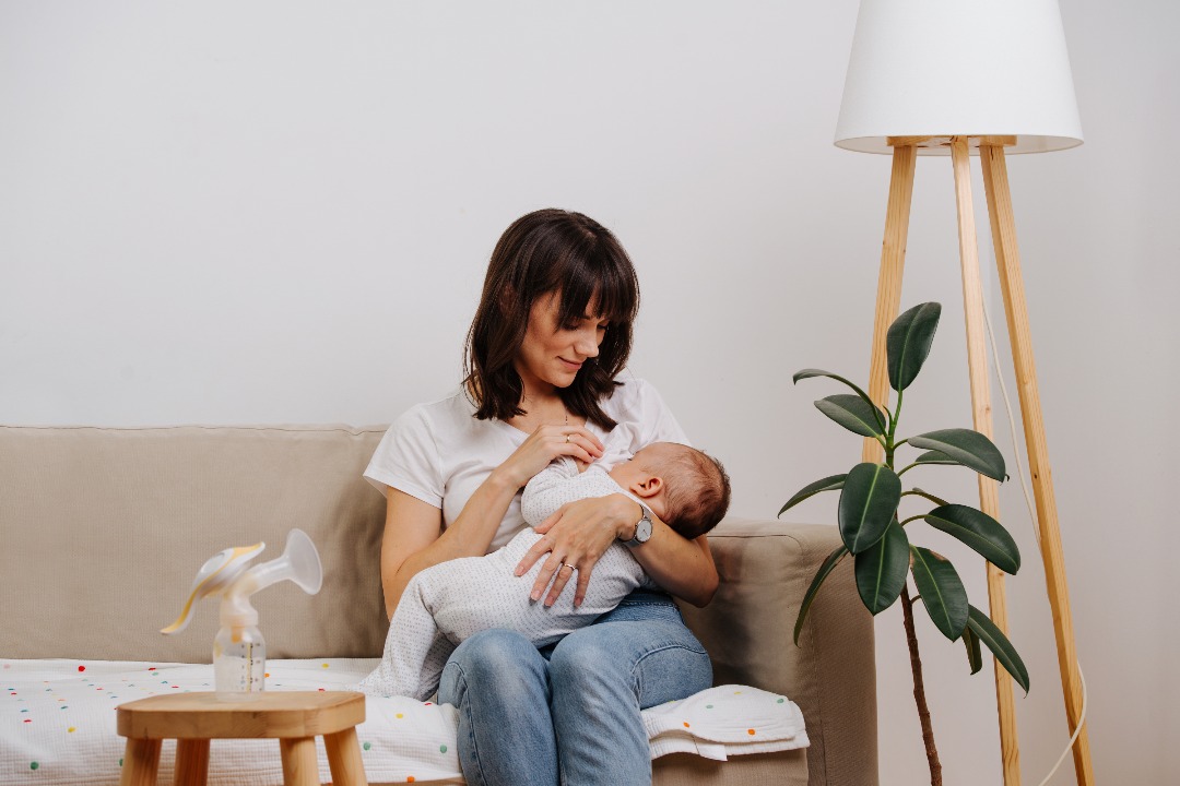 breastfeeding mom with infant