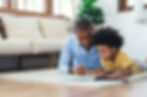 father and daughter reading at home