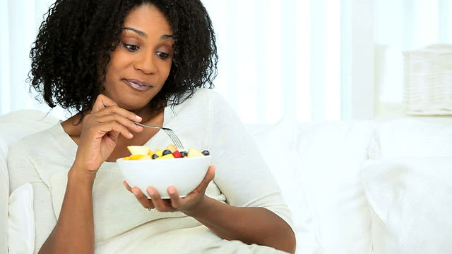 women eating fresh fruit