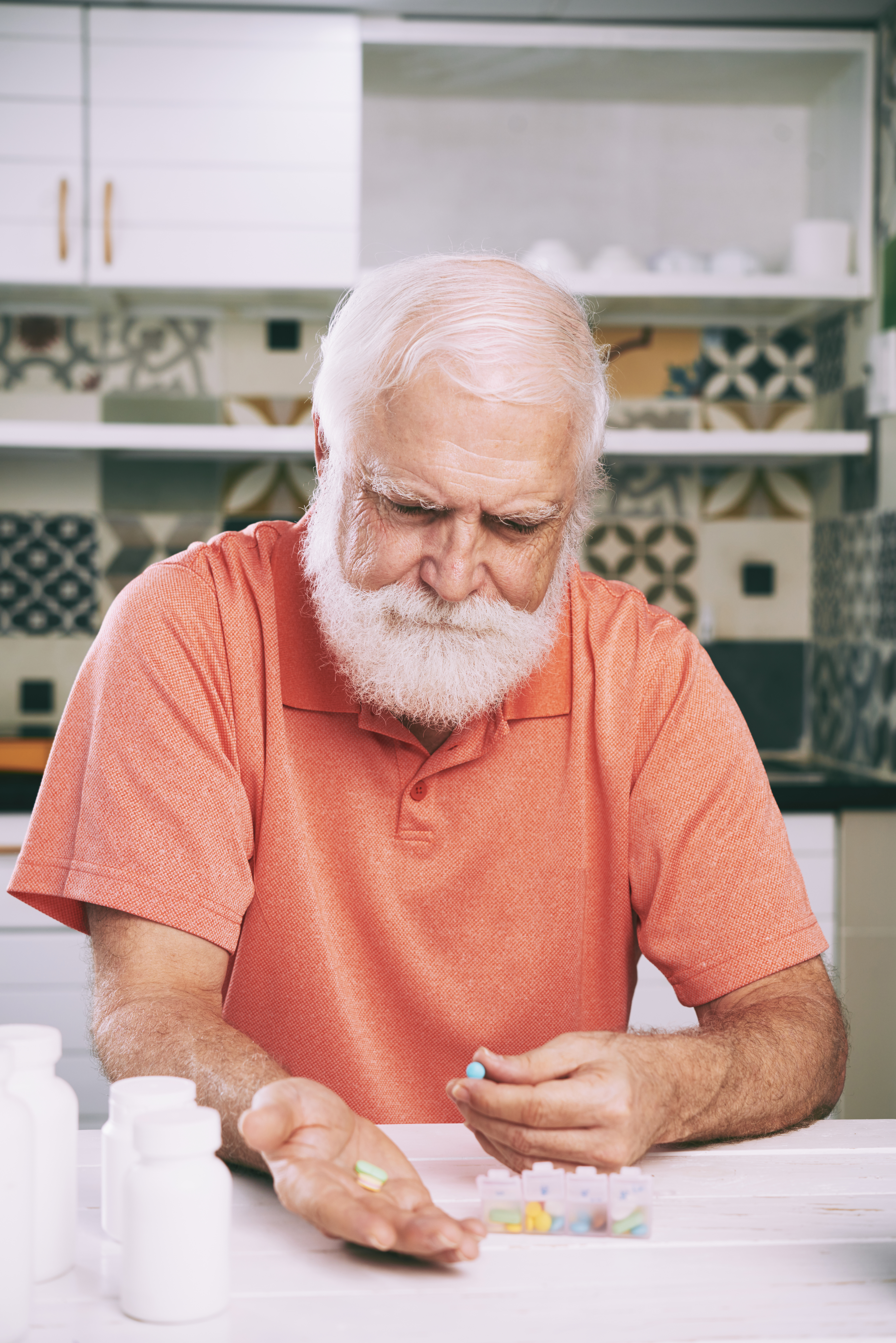 senior man taking medications