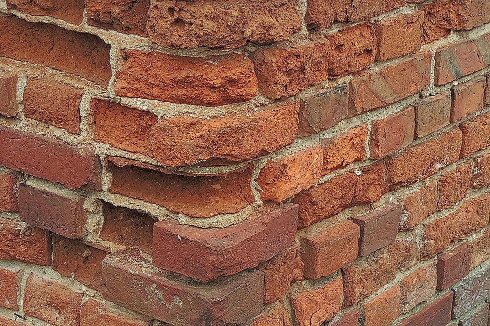 Brick wall with bricks that need replacing or turning. Image on the website of Gladstone Pointing Limited, West Bridgford, Nottinghamshire