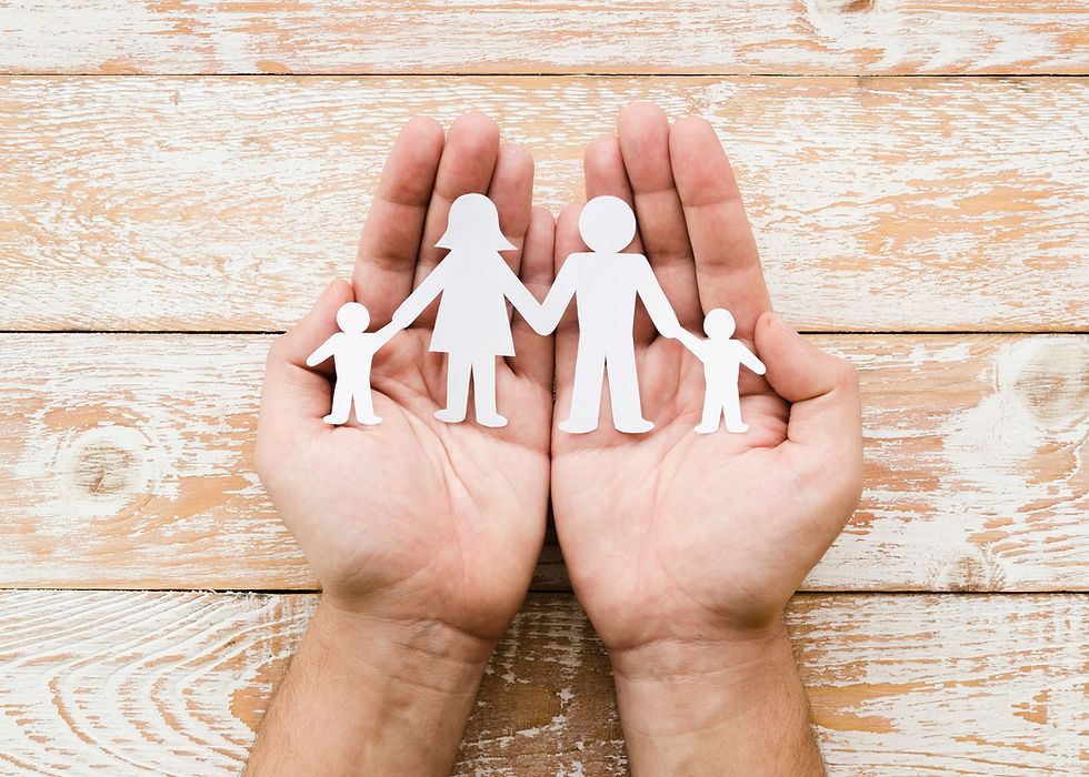 person-holding-paper-family-hands.jpg