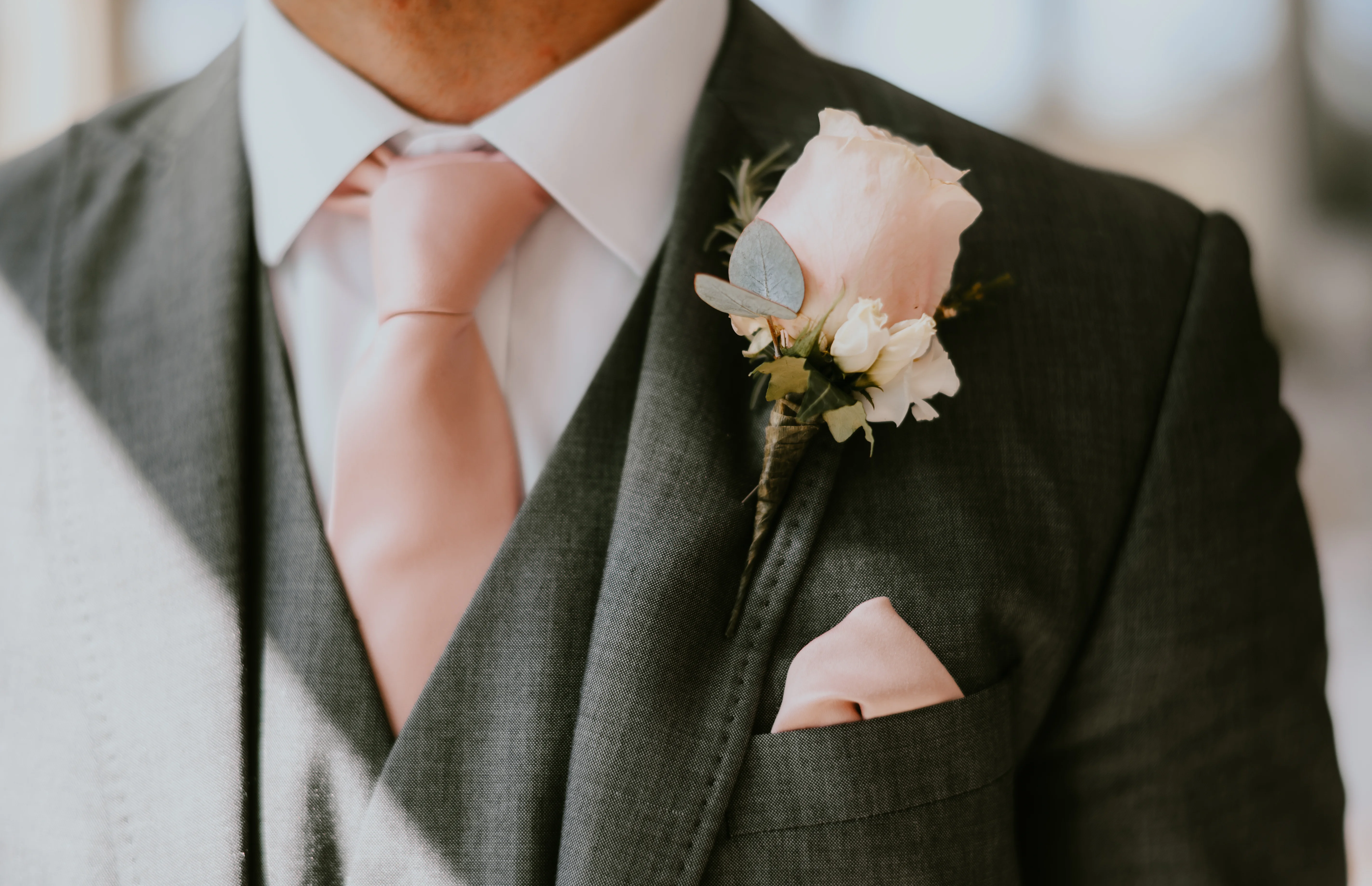 Boutonniere for groom pink flowers