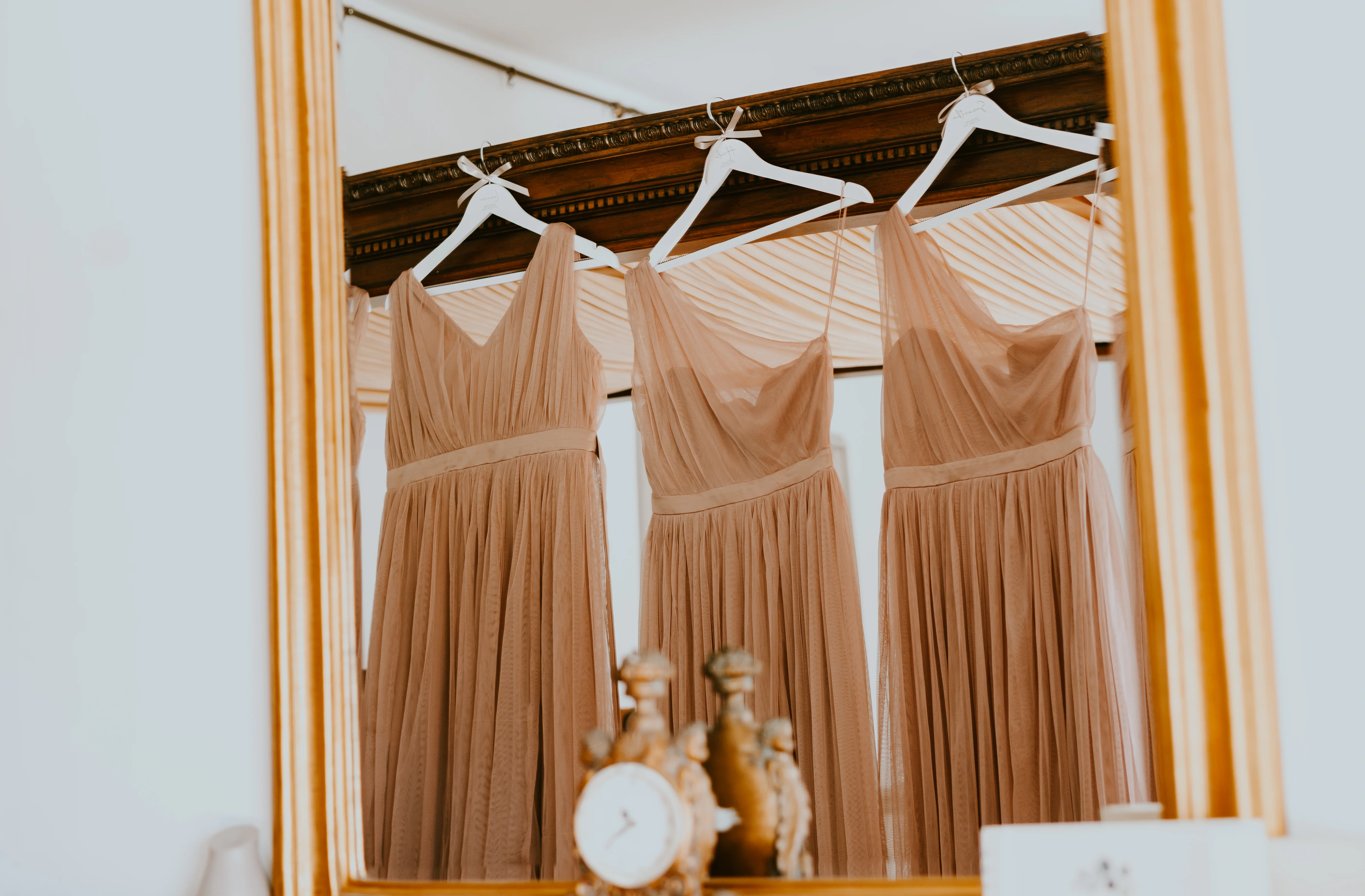 Bridesmaid Dresses hung in bridal suite