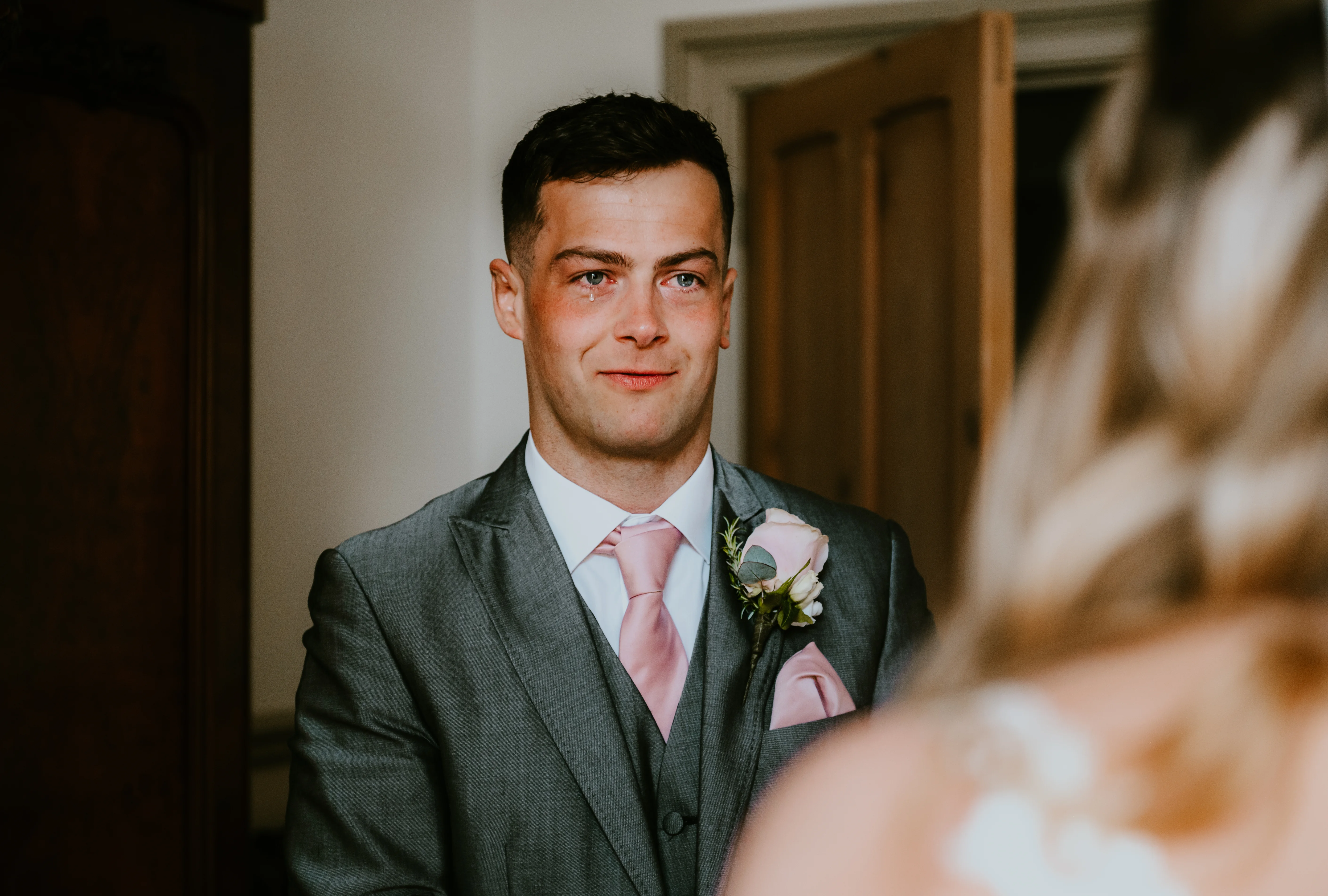 Groom crying at first look with bride