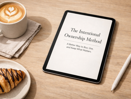 Minimal workspace scene featuring a tablet displaying “The Intentional Ownership Method,” alongside coffee and a pastry, representing thoughtful, intentional living and simplified ownership.