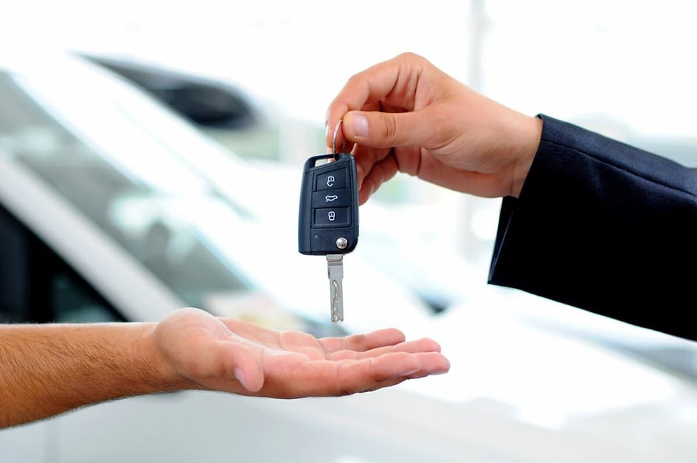 a person handing over a car key