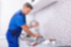 plumber installing a new kitchen sink