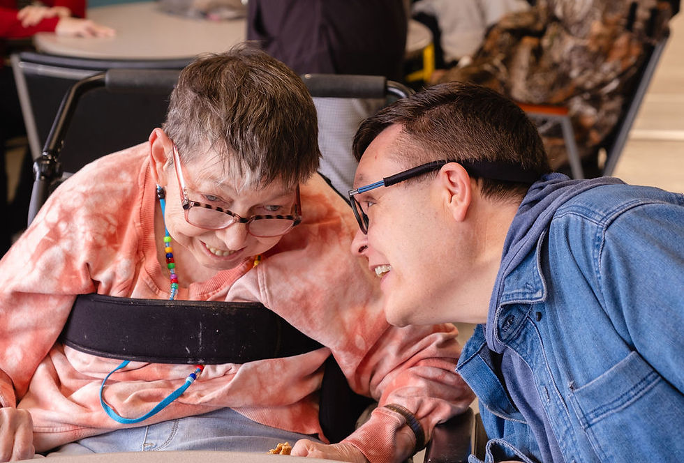 Two participants smile during their conversation