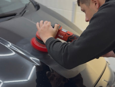 Person machine polishing a car