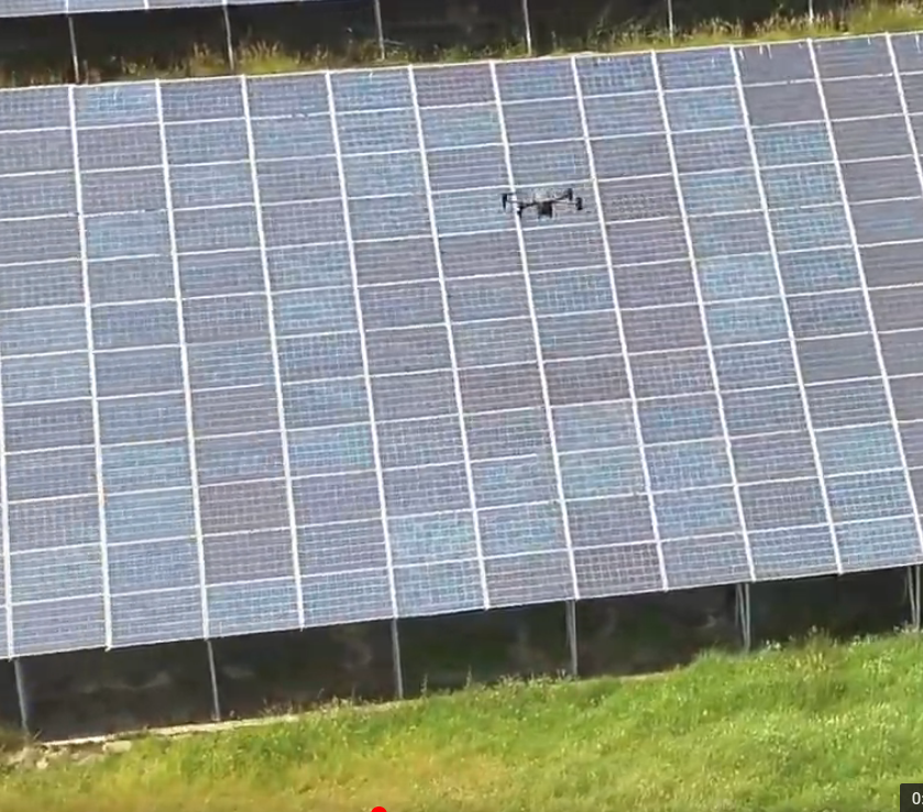 drone flying over solar panel for inspection