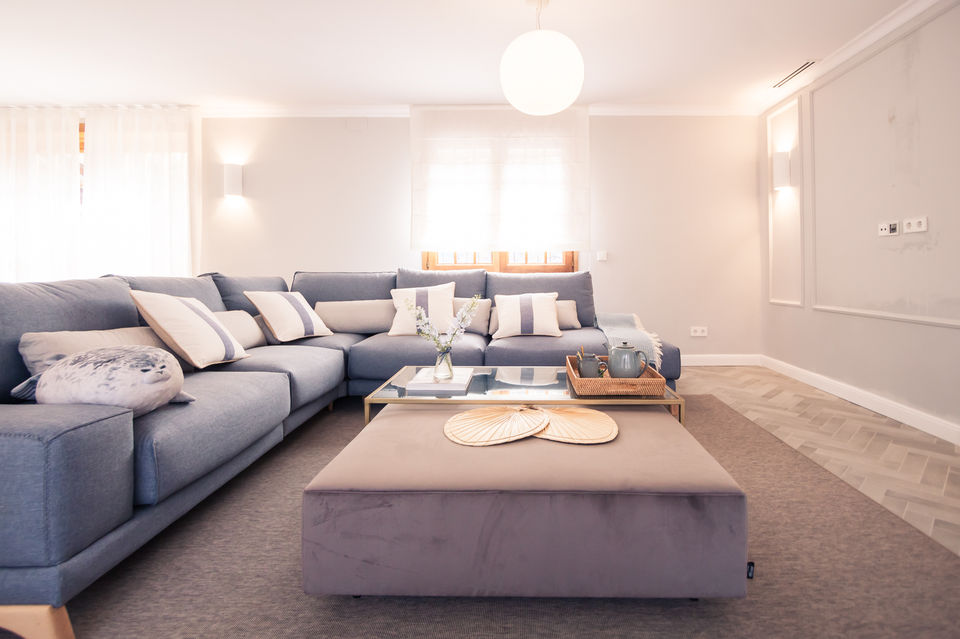 Mediterranean modern classic Living room In Sitges, with blue and earthy tones color palette, designed by the Interior Designer Jimena Sarli from the Interior Design Studio Lady J. Interiors