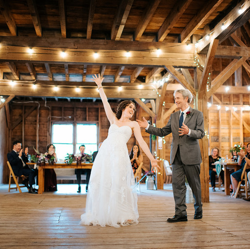 Father and daughter dance in Vermont barn