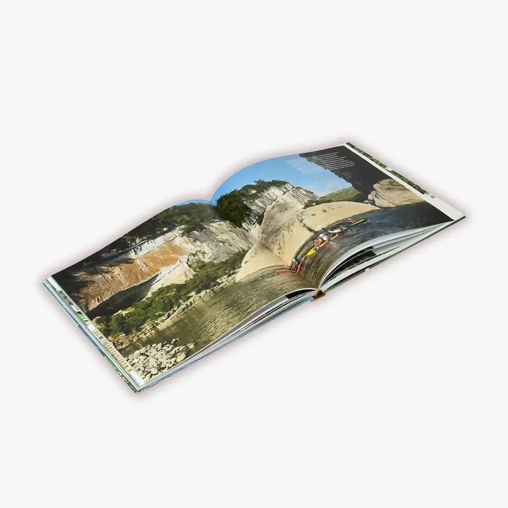 Open Smyth-sewn hardcover book showing secure pages, a straight spine, an aligned rigid case, and evenly positioned endpapers