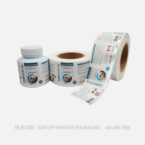 Rolls of custom roll labels being printed on high-speed label printing machinery in a modern factory