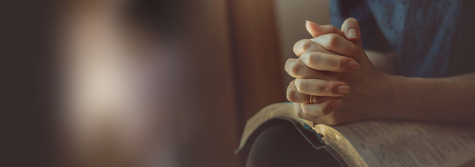 Hands praying Bible.jpeg