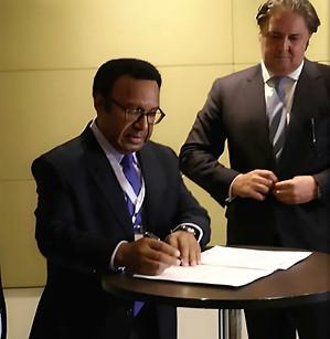 Mr. Darren Young, Managing Director of Kumul Consolidated Holdings Ltd, witnessed the signing of the Agreement between Indust