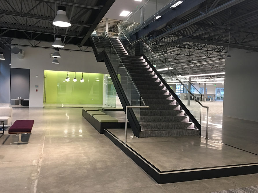 monumental custom steel staircase with glass railing
