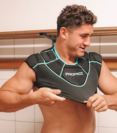 Player trying on Best rugby shoulder pads