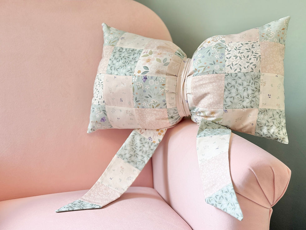 'Sky Garden' Patchwork Bow Cushion by Cassandra Connolly