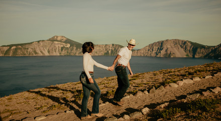 Couple walking along the cliffside during a photoshoot