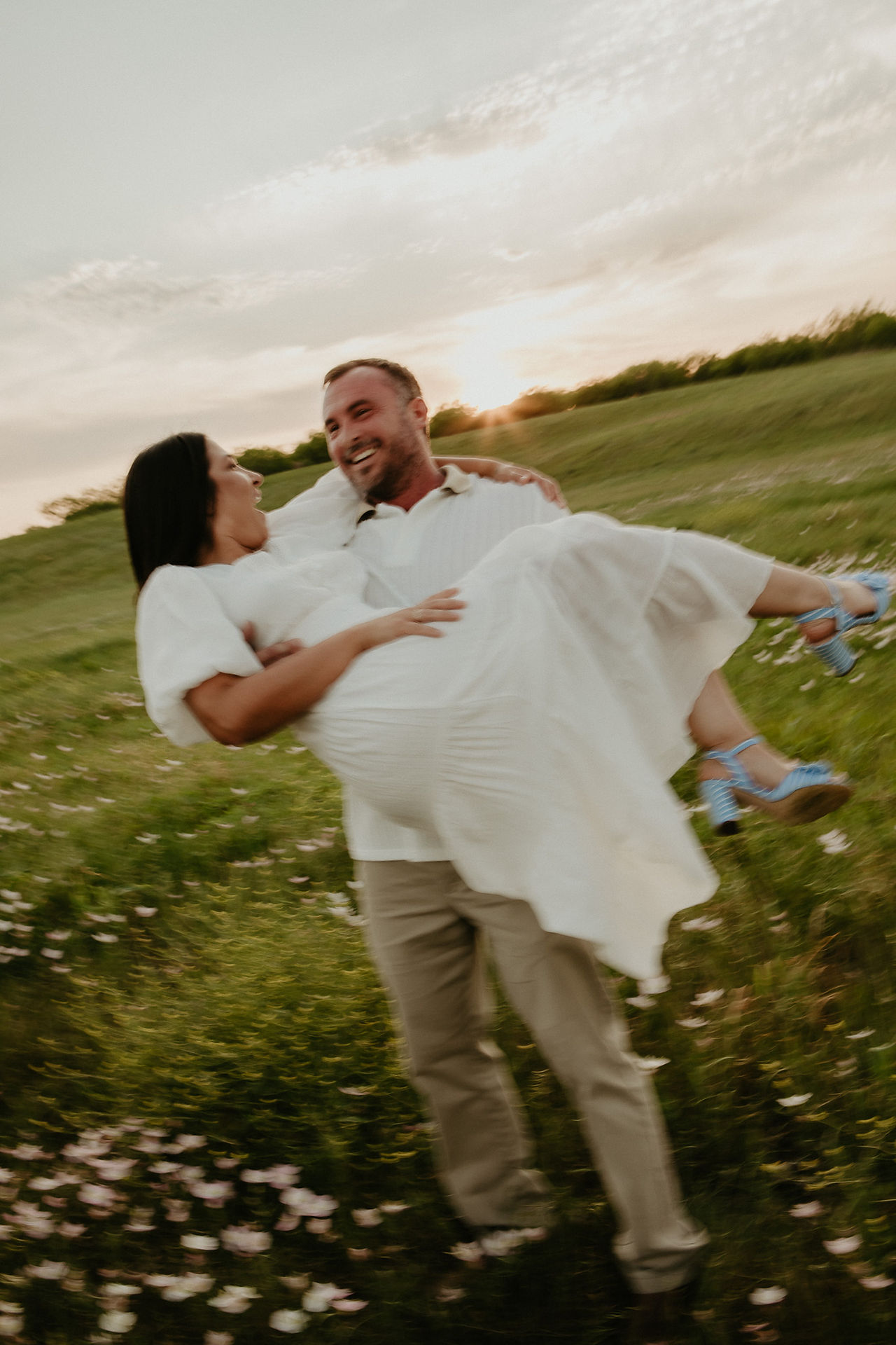 Blurry photo of couple in the sunset