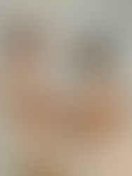 Couple embracing with sky and clouds behind