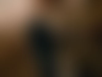 editorial portrait of woman throwing coat towards camera in texas field