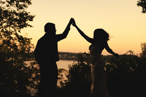 Couple dancing together in front of Lake travis at sunset with a texas photographer