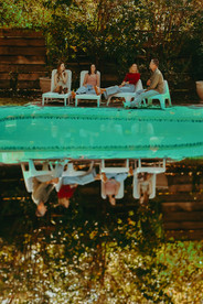 double exposure photograph of king family standing by pool