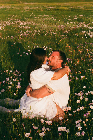 Fim photo of a couple in white clothes touching noses