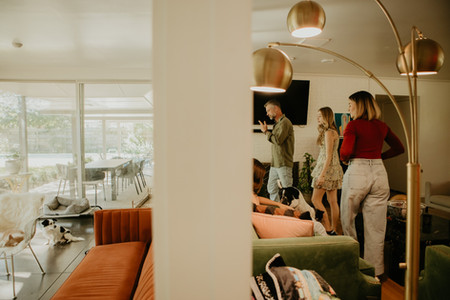 Family walking through house together during documentary session in belton texas