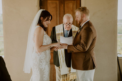 bride and groom exchanging rings