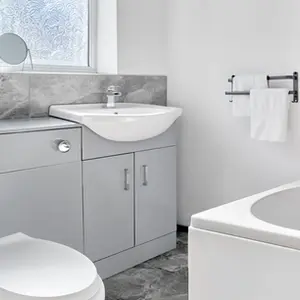 Property Photography North East is a folio of North Star Images
Specialising in Serviced accommodation photography, bathroom Photography HMO Photography and student accommodation photography Peterlee
This serviced accommodation features a modern bathroom with a white sink on a grey cabinet, a toilet, and a bathtub. Grey tiled walls and floor showcase a clean, modern look. This was photographed in Peterlee for online listings by property Photography North East a folio of North Star Images.