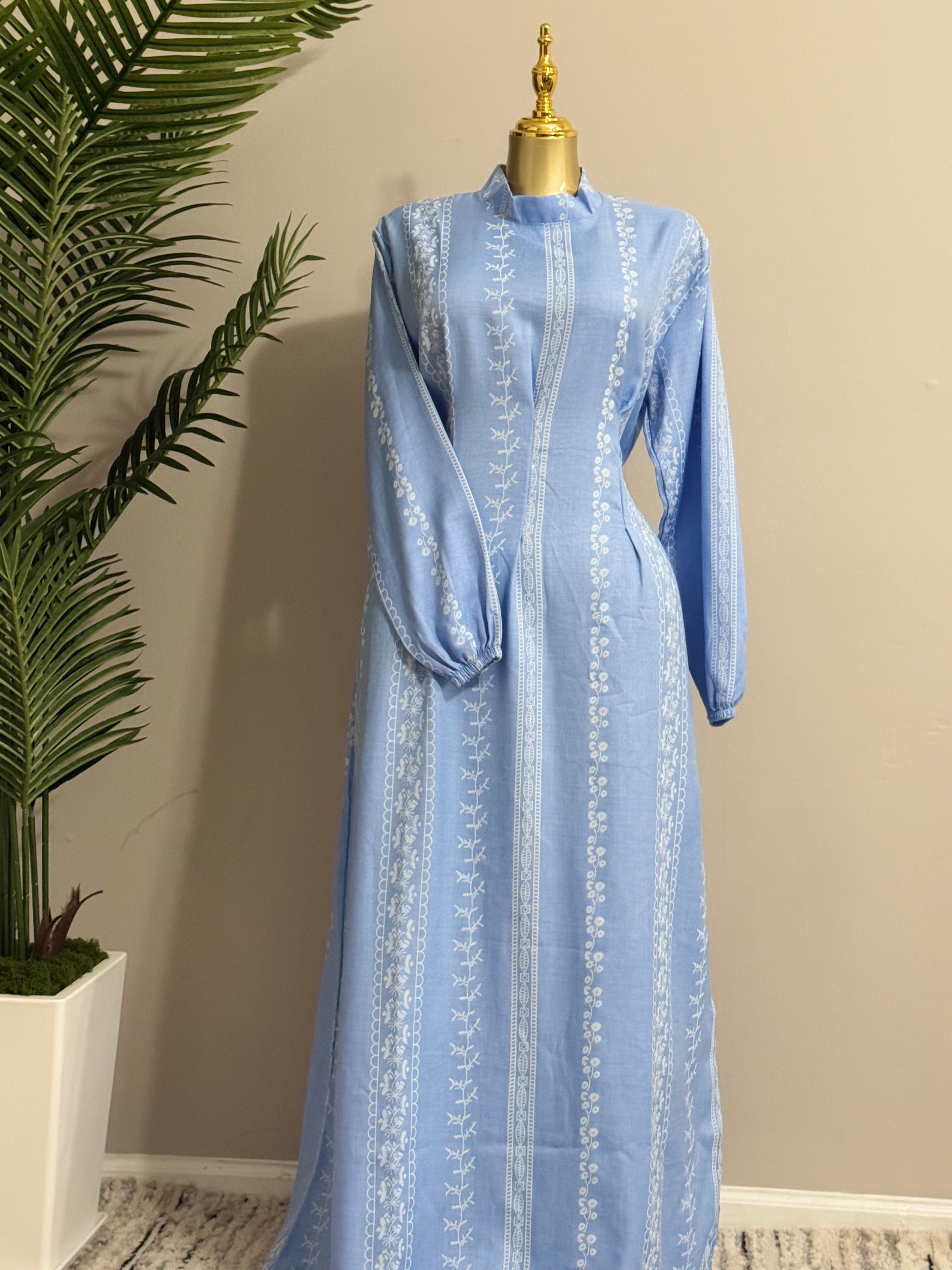 A classic long straight-cut tunic (kurti) profile finished with cinched puff sle